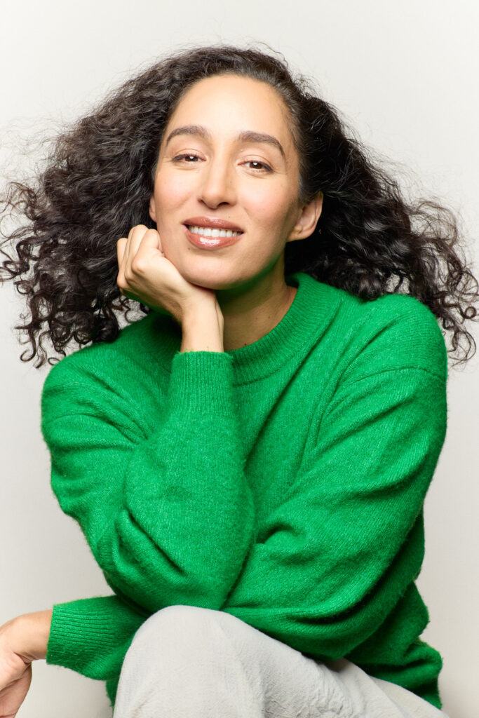 Smiling woman in green sweater