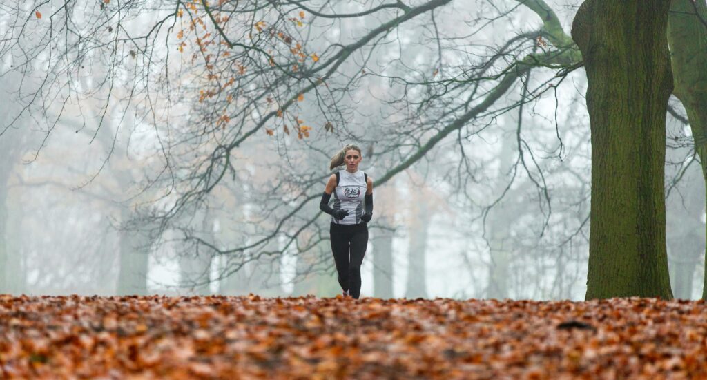 Woman running alone in woods