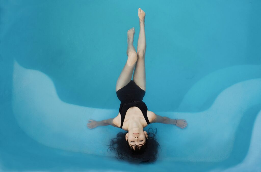 Woman with eyes closed in pool